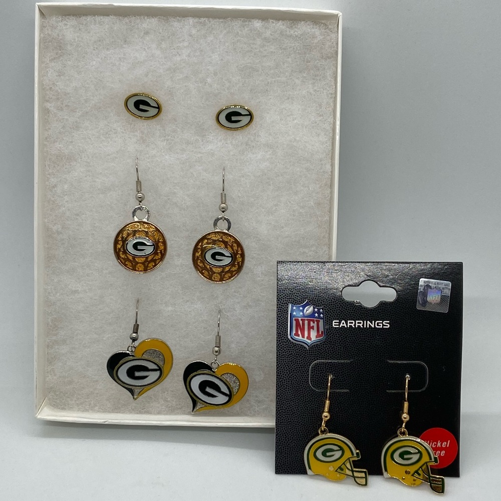 Multiple pairs of Green Bay costume earrings